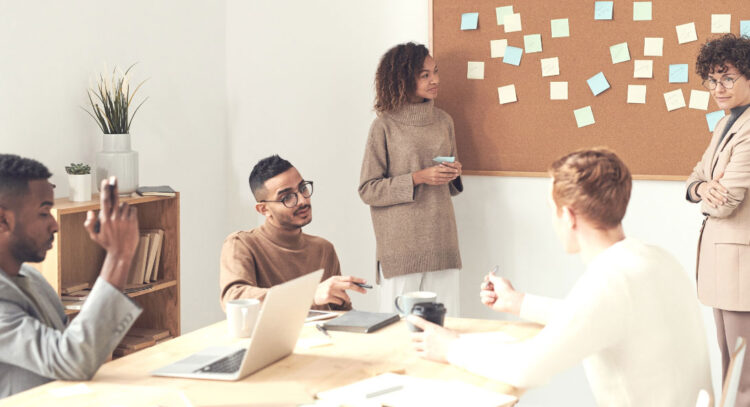 meeting with sticky notes on wall