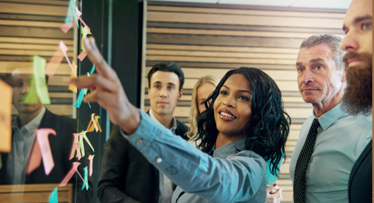 woman explaining thought leadership to team