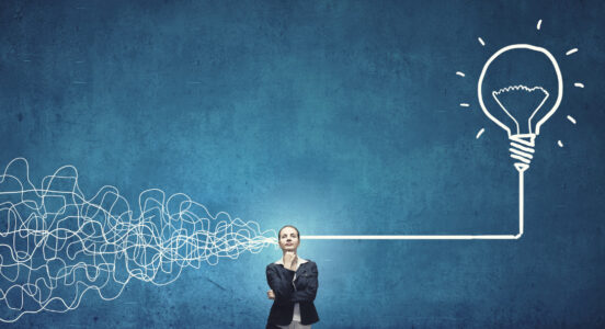 wiring going through a woman's head into a light bulb graphic blue background